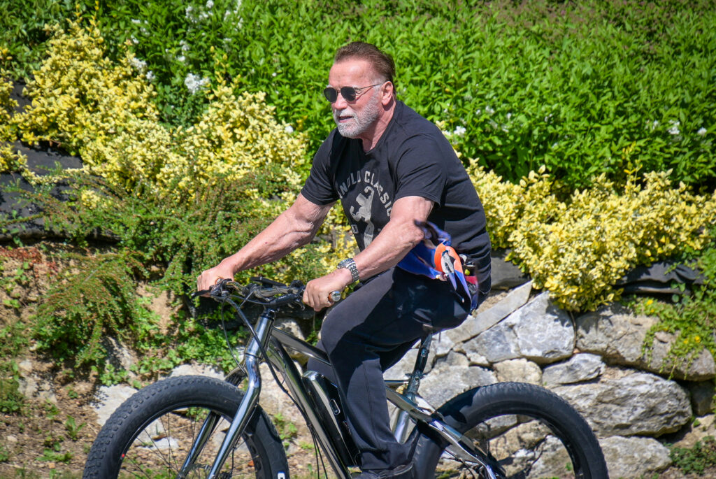 Arnold Schwarzenegger Returns to His Roots: Hollywood Icon Cycles Through Austrian Hometown
